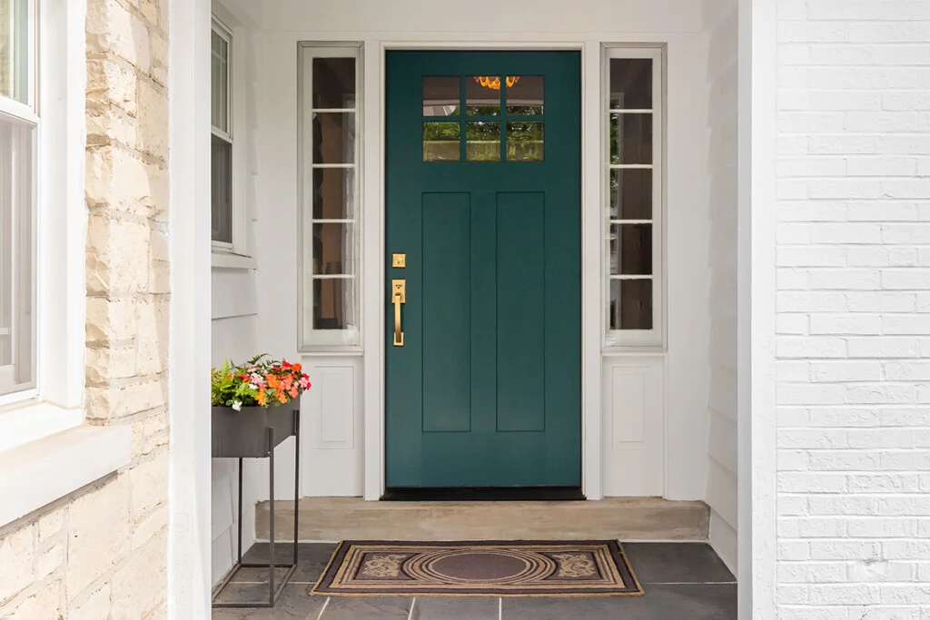 A fresh coat of paint being applied to a front door
